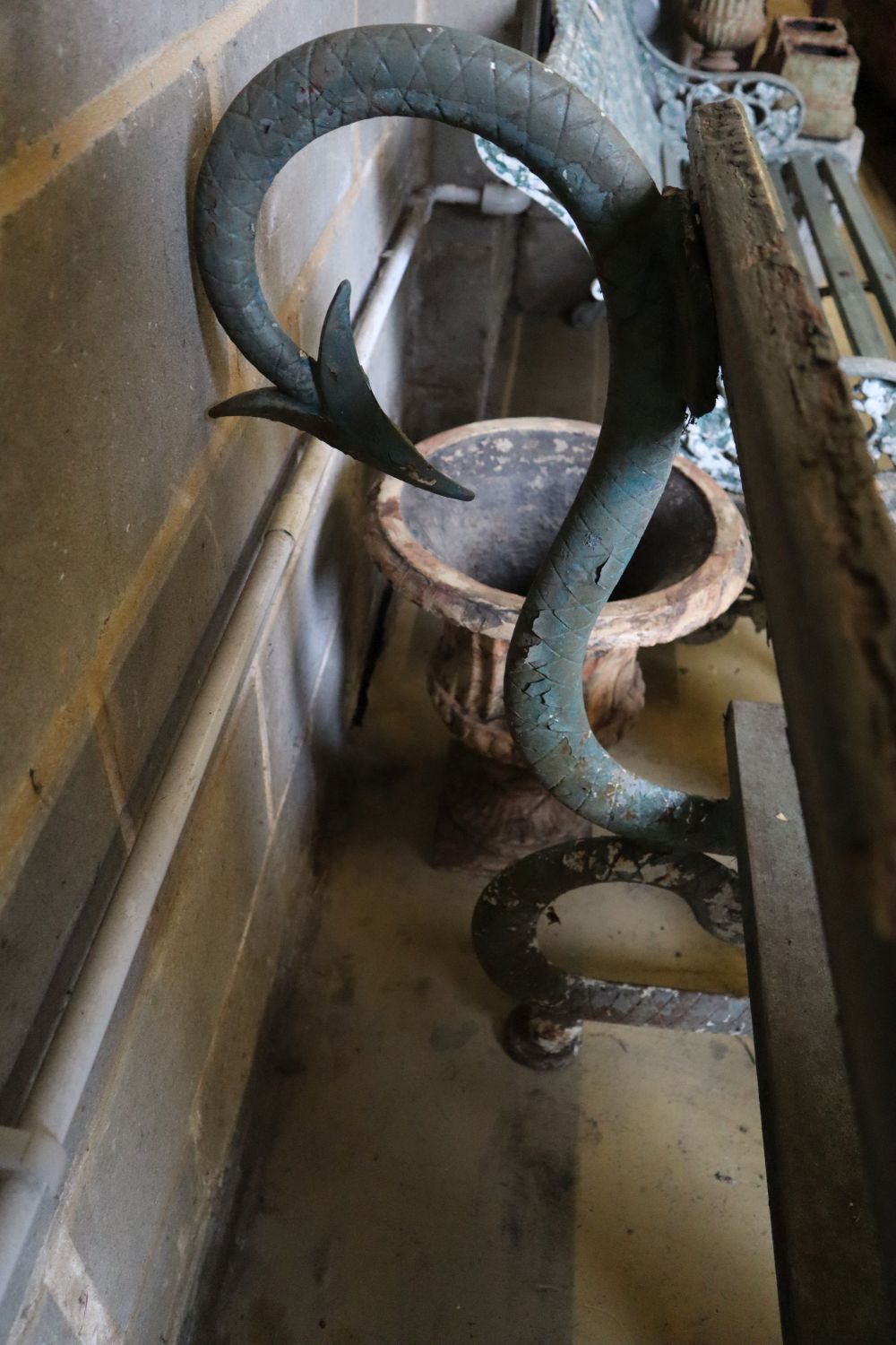 A Victorian cast iron serpents garden bench with painted wood back and seat, width 127cm, height 95cm